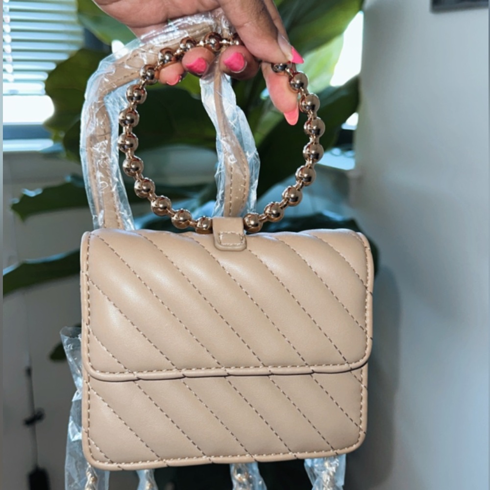 Never before used tiny purse / clutch. Very good condition.